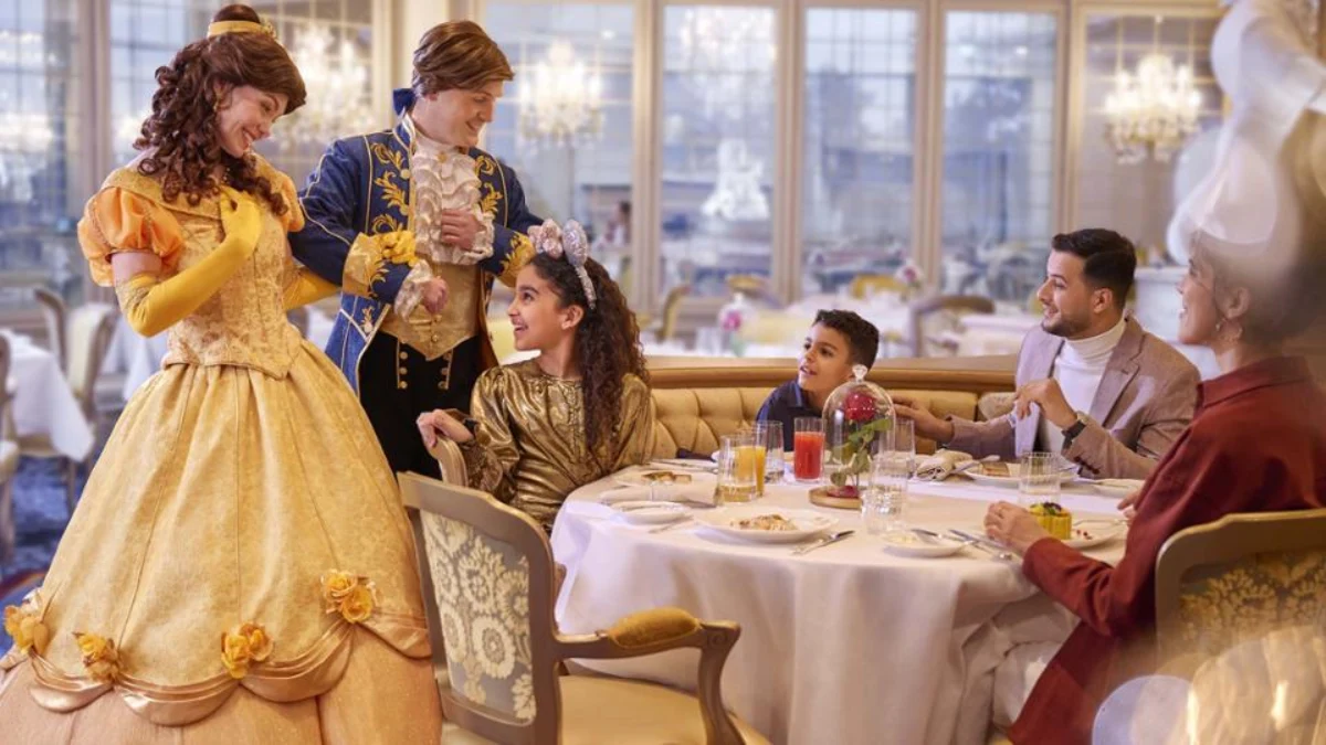 A family enjoys dining with Disney characters at a themed restaurant