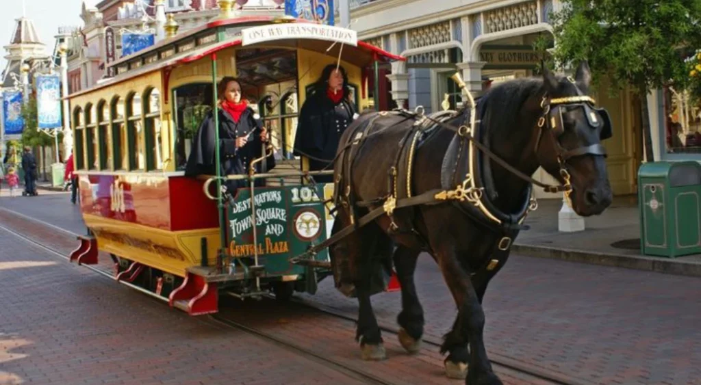 Horse-drawn streetcar carries guests down Main Street at Disneyland Paris