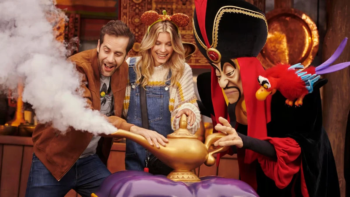 A couple rubs a smoking magic lamp with Jafar and Iago