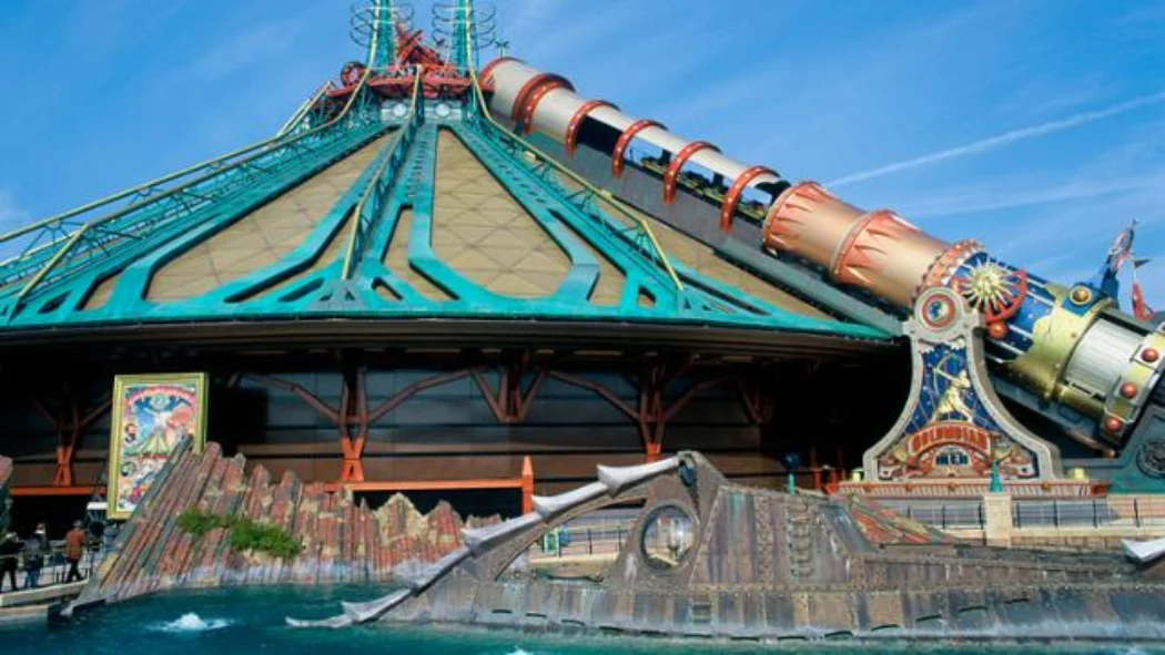 Exterior view of Space Mountain roller coaster at Disneyland Paris with its steampunk-style design and launch cannon